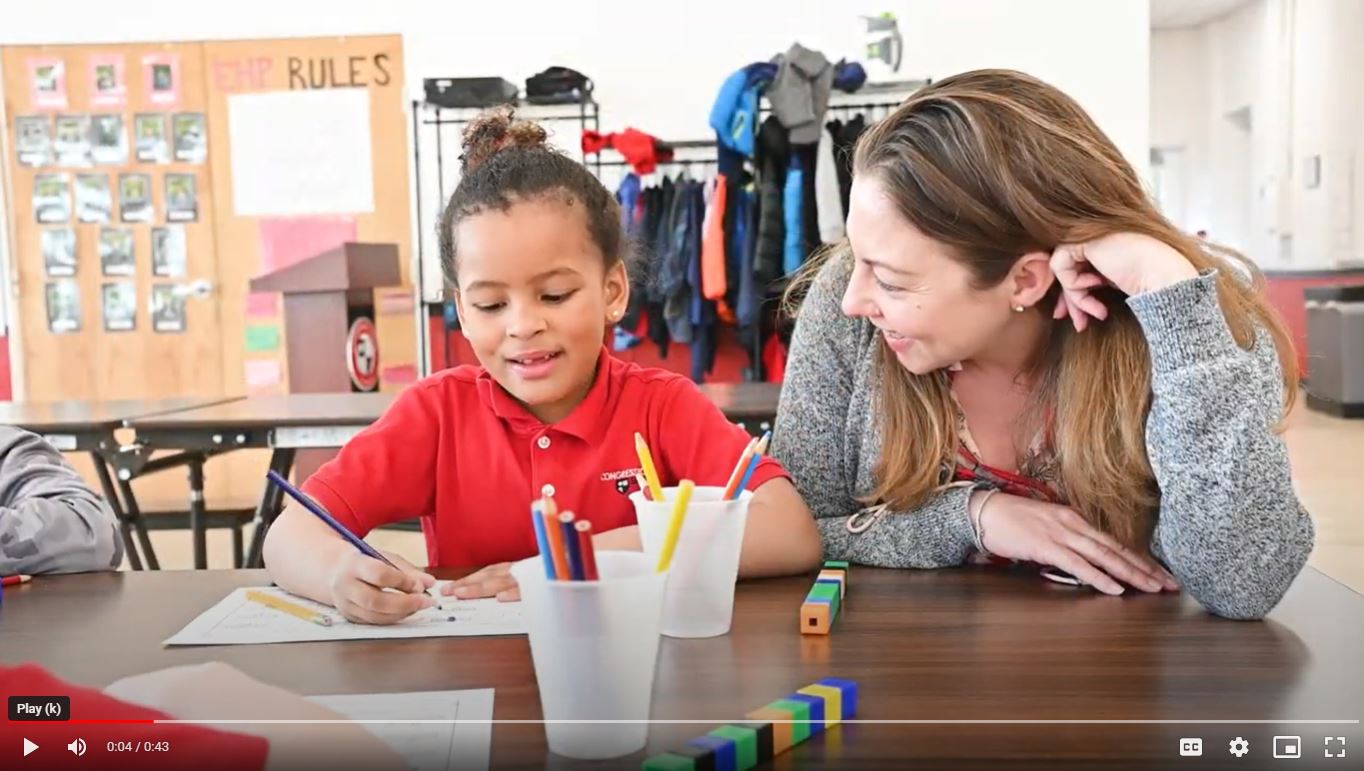 Congressional School teacher working with student